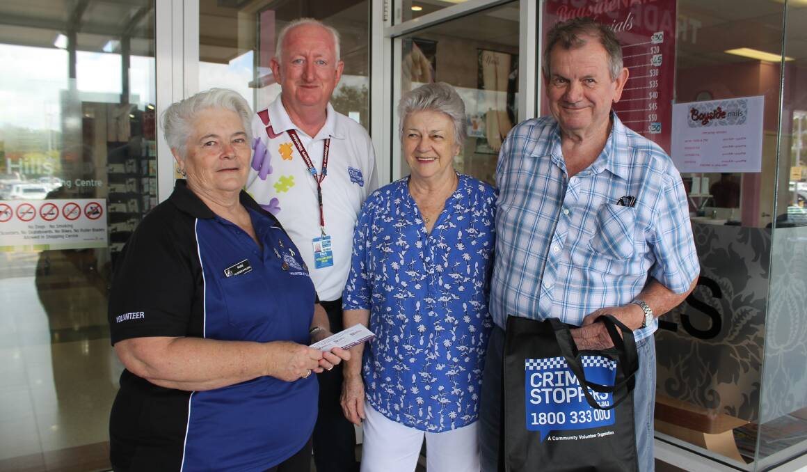 Police volunteer Rosie Nicol and the chairman of the Brisbane Bayside Volunteer Area Committee of Crime Stoppers Paul Fitzpatrick, with Birkdale residents Rodney and Sandra Paxman at Coffee with a Cop on Friday. Photo: Cheryl Goodenough