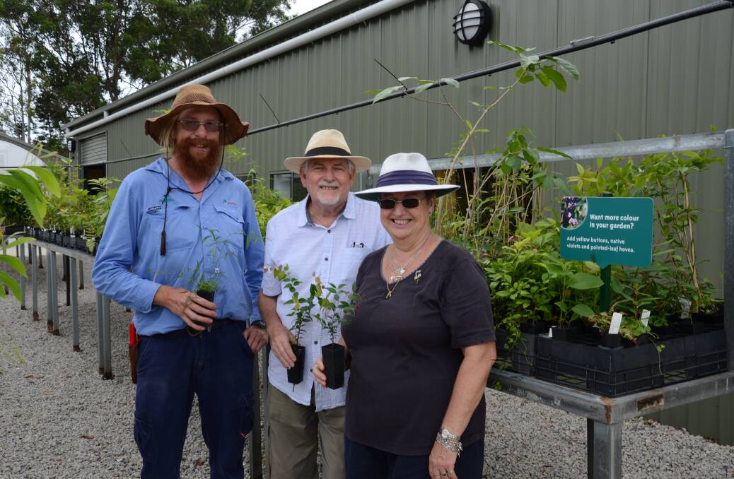 GETTING READY: Nursery co-ordinator Ben Webb and volunteers Ron Dunlea and June Gibb put finishing touches to the new nursery ahead of the official opening. Photo: Redland City Council
