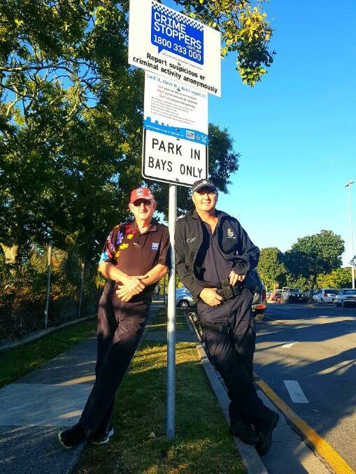 CREATING AWARENESS: Brisbane Bayside Volunteer Area Committee member Paul Fitzpatrick and Acting Sergeant Brendon Winslow with the sign at the Stradbroke Ferries carpark on Emmett Drive, Cleveland.