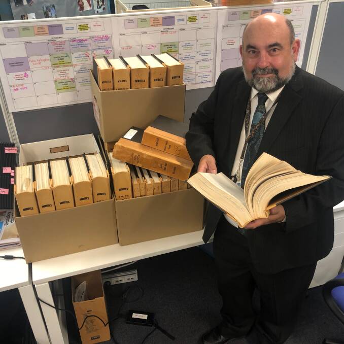 HISTORY: Cr Mark Edwards with council records from the early 1970s that he has been reading to get an insight into the provision and funding of island and mainland infrastructure.