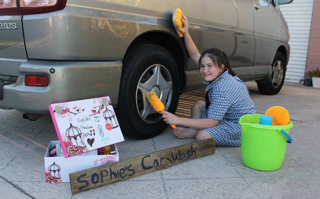 ENTREPRENEUR: Twelve-year-old Sophie Small has started a car wash business to help support her sister's medical and therapy costs. Photo: Cheryl Goodenough