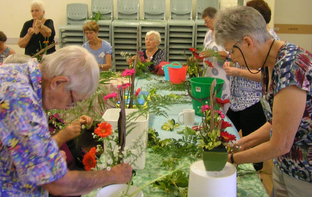 FLORAL INSPIRATION: Redlands Floral Art Club members are involved in the project with Queensland Rail to transform the Ormiston rail bridge.