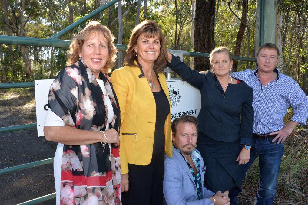 LAND: Councillors include mayor Karen Williams (second right) outside the Birkdale bushland. Photo: Brian Williams