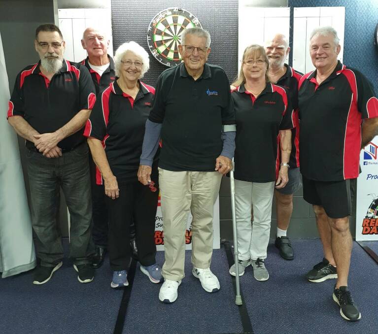 RED BARONS: Don Williams (centre) at 90 years old is a member of the Red Barons team at Redlands Darts Association.