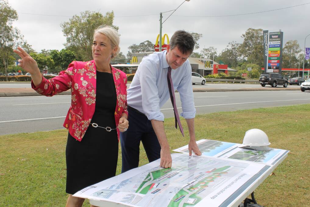 VICTORIA POINT: Redlands MP Kim Richards and Transport Minister Mark Bailey look at designs ahead of work starting on the Victoria Point Central bus station on Cleveland-Redland Bay Road.
