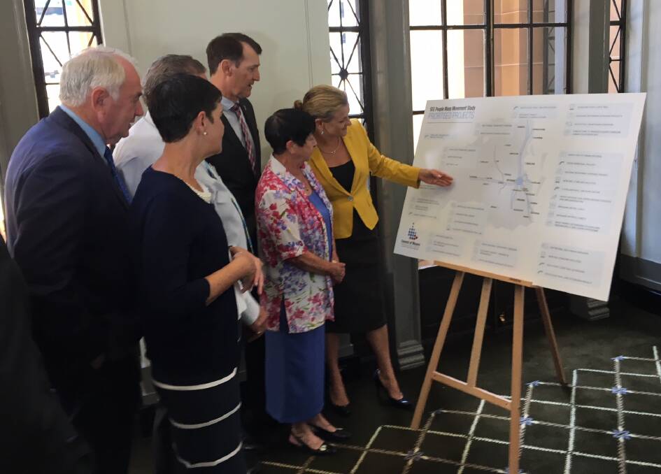 REVIEW: Mayors from south-east Queensland councils, including Redland City mayor Karen Williams (right) review the People Mass Movement Study road map.