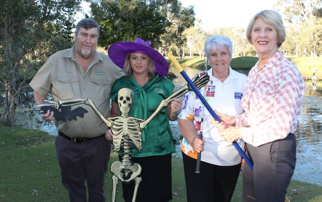 SPOOKY: Getting props ready for a golf day to raise money for Crime Stoppers are sponsors Peter Goleby and Justina Cassidy from Mount Cotton Landscaping, Kathy Huf, a volunteer from Crime Stoppers Brisbane Bayside and  Karen Gold, from sponsor Victoria Point Community Bank Branch of Bendigo Bank. Photo: Cheryl Goodenough