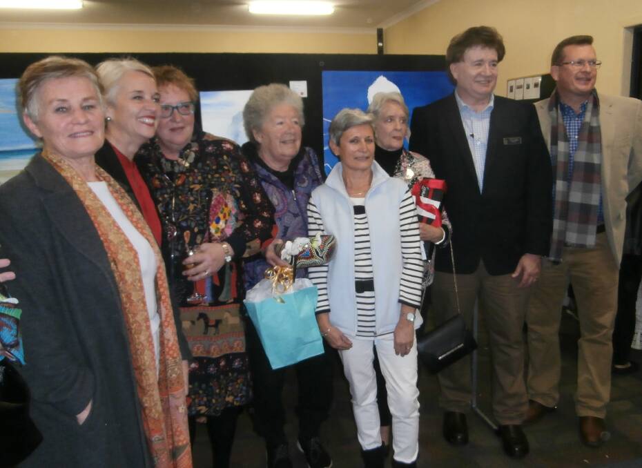 OPENING NIGHT: At the opening night of the Coochie Art Show are Leonie Bosscher, MP Kim Richards, Mary Russell, Mary Preston, Catherine Bishop, Denise Foley, Cr Lance Hewlett and Cr Paul Golle.