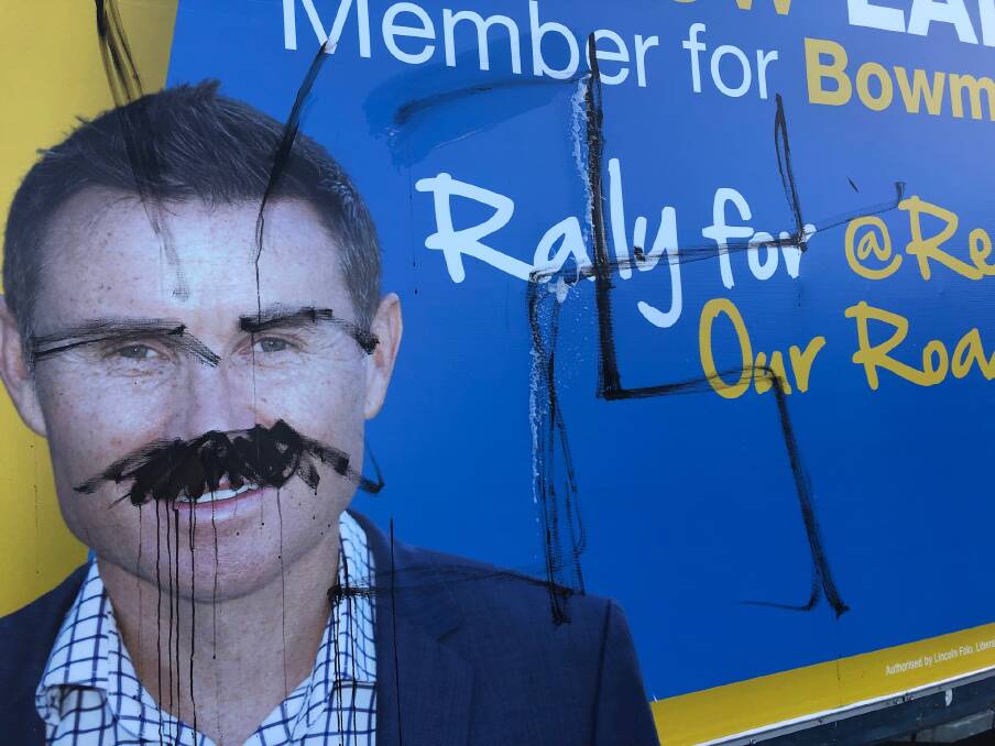 GRAFFITI: An election sign on a trailer parked on Wellington Street at Thornlands was defaced last week.
