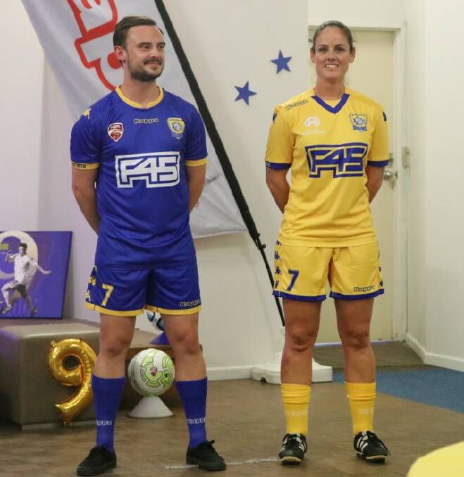 NEW KITS: Justin McMullen and Stephanie Latham show off the new kits to Capalaba Bulldogs players on Friday.