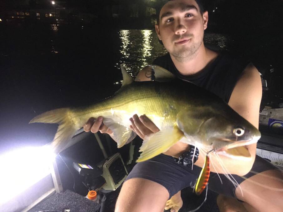 NICE CATCH :Tom Ogle with a threadfin from the Brisbane River caught on a IMA Koume lure. Picture: Supplied.