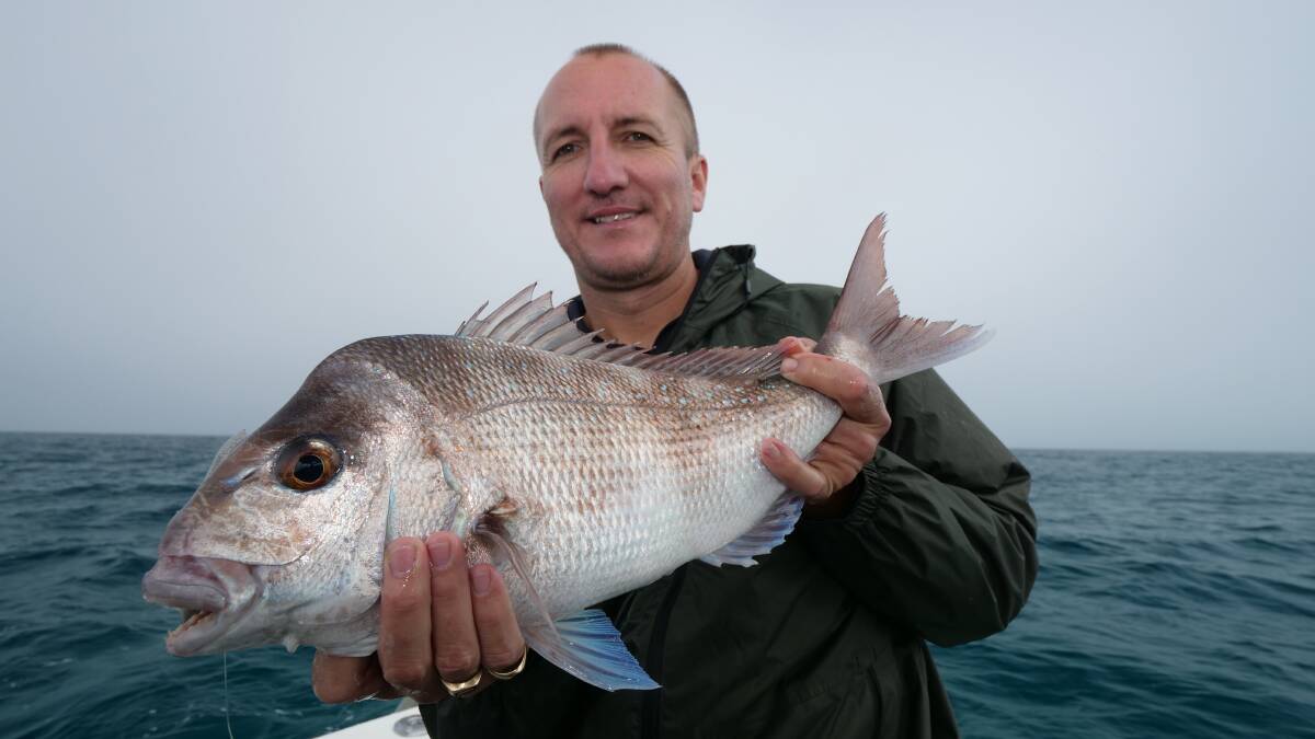 SNAPPED UP: Russell Hall with a 70 centimetre snapper caught in Moreton Bay on a soft plastic lure.