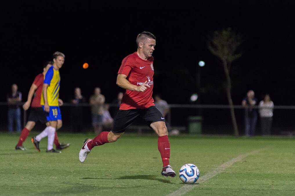 SETTING UP: Graham Fyfe sets up play for Redlands United during the Red Devils National Premier League clash with the Brisbane Strikers last Friday evening. Picture: Andrew Hudson.