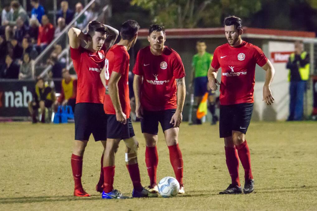 ON THE ATTACK: Redlands United look to make the most of an attacking free kick. United captain Graham Fyfe is to retire. Photo: Ray Gardner