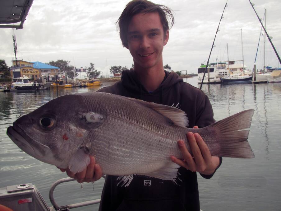 HUGE CATCH: Hamish Cavanagh with a trevally caught onboard Coastal Sport Fishing Safaris. Photo: Supplied