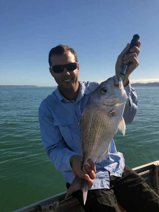 NICE ONE: Eric Olsen with a 58cm snapper from the bay. 