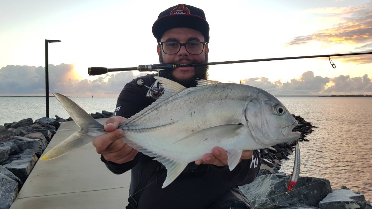 NICE TREVALLY: Adam Griffith with an early morning lure caught trevally off the Manly rock wall. 