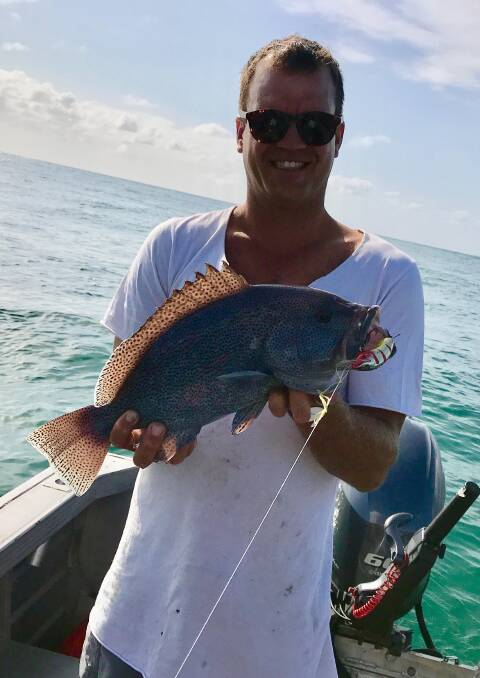 COD CAUGHT: Joe Barker happy with his purple cod caught off Moreton Island on a lure at the weekend. Picture: Supplied.  