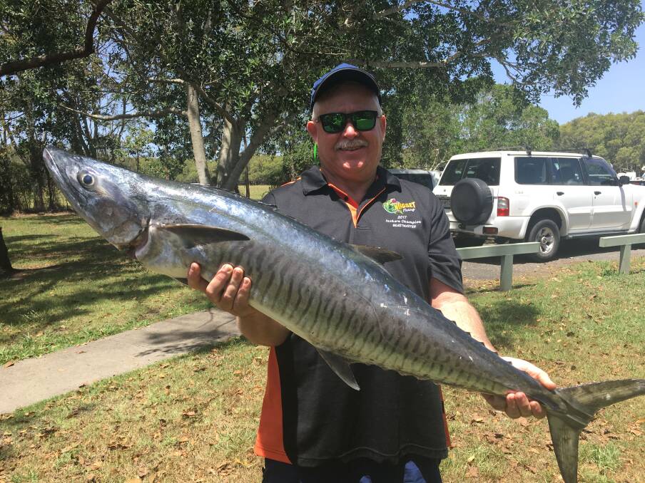 HOLY MACKEREL: Neil Stratford with a 12kg Spanish mackerel caught off the Sunshine Coast. 