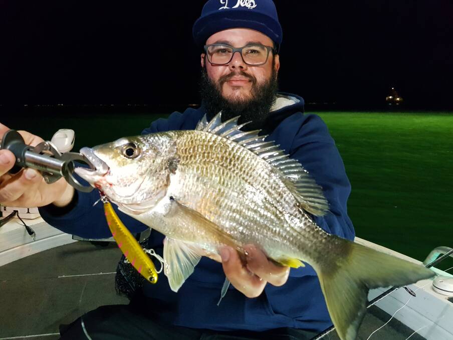 NICE BREAM: Adam Griffith with a nice bream caught from the Brisbane River on the IMA Koume lure. Whiting also are being caught in most of the regular places.