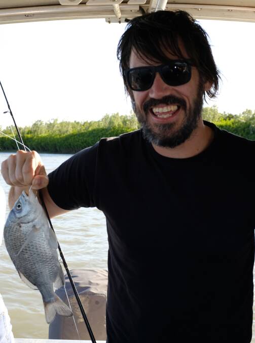 CATCH AND RELEASE: Chris Jahnsen happy with his first bream for the season, under size and released. 