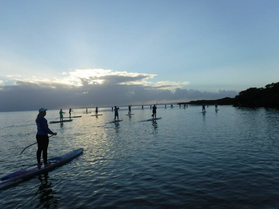 Sunrise paddle with friends. Photo: Anita Harwood. 