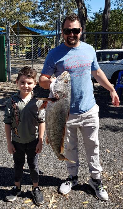 HUGE CATCH: Dan Mattoso and son Ky showing off an 8.5kg mulloway caught off the Jumpinpin Bar.