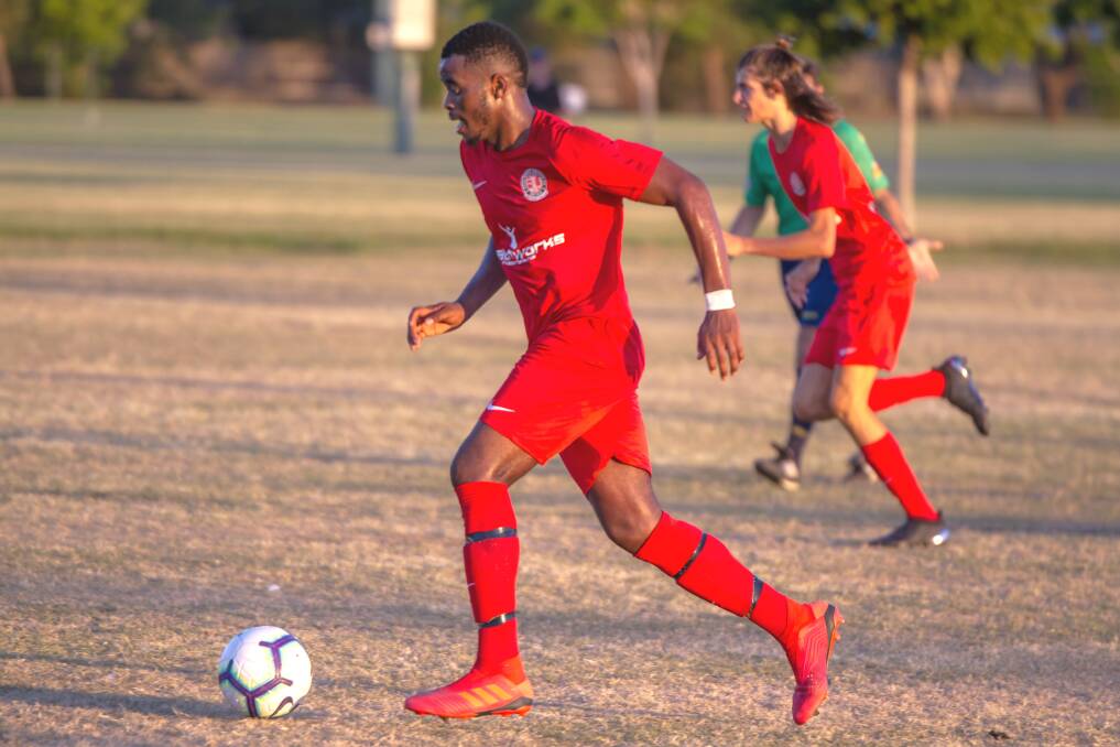Redlands United’s Raphael Ngoyi on the ball during pre-season hitouts at the Cleveland Showgrounds.   Photo: Ray Gardner
