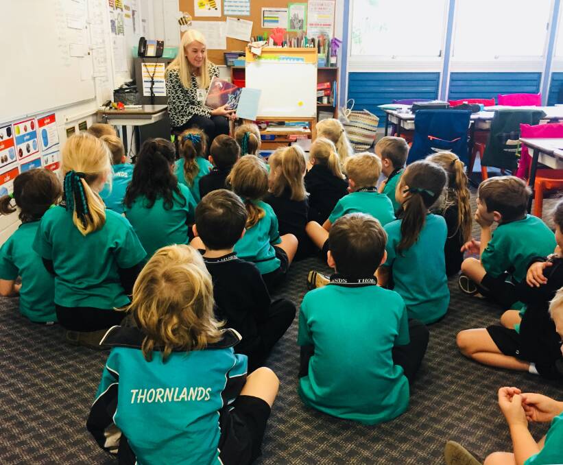 BOOK WORMS: Redlands MP Kim Richards reading to Thornlands State School students  stories from Quandamooka Dreaming by Sandra Delaney. 