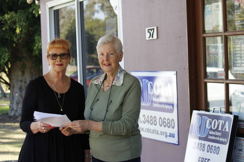 HOPE: Redlands resident Karen Griffith hands her completed survey to RDCOTA’s Fay Dougall, which is expect to help council form the Age-Friendly City Strategy to improve the lives of seniors living in the community.