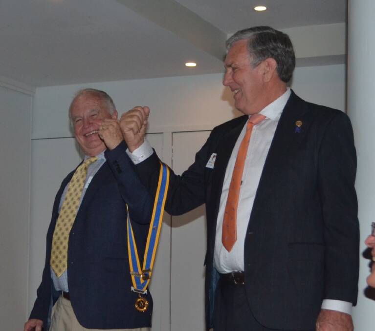CHANGEOVER: Rotary Club of Capalaba members Peter Mathews and David Field, with their presidents' medal, will lead the next term. Photo: Supplied
