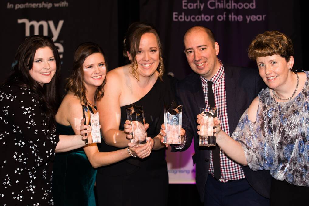 EDUCATION: EDUCATION: Aisling Farling and Rebecca Grugan (middle) from The Hills Montessori accepting one of four national awards, Service of the Year Award, in the Australian Early Education and Care competition. 