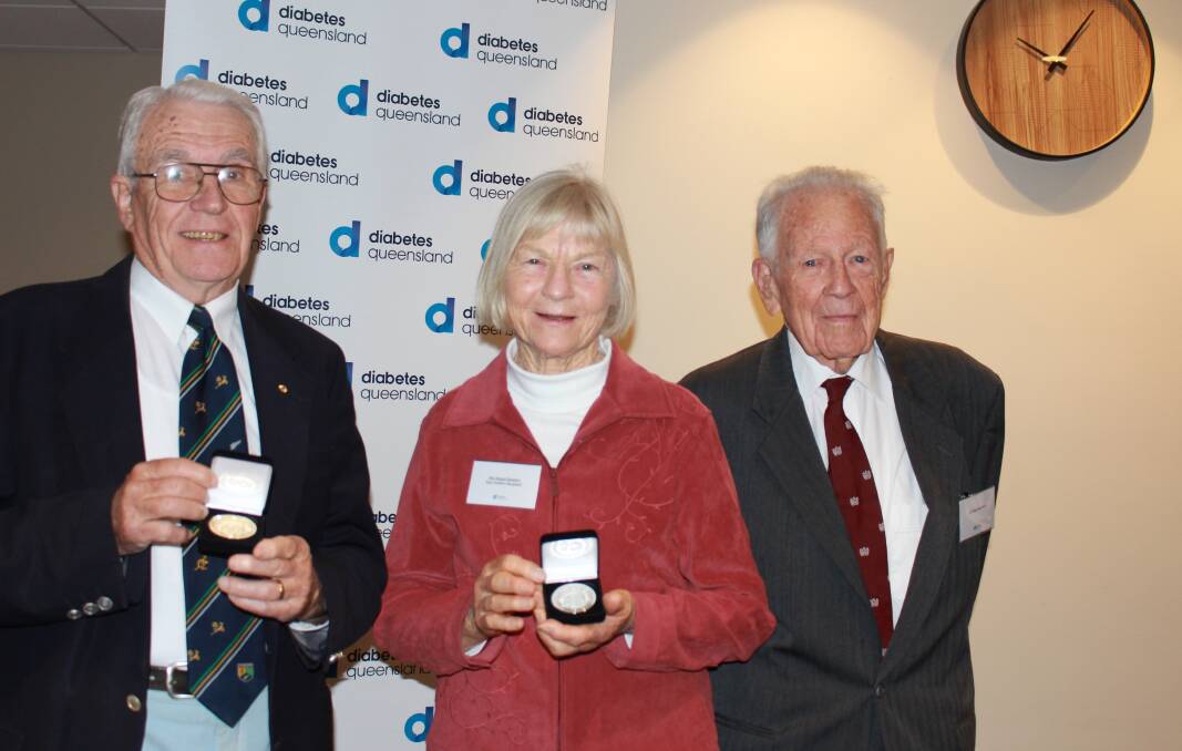 CELEBRTION: Noela Rawlins receiving her 60 year Kellion medal from Dr Alan Stocks AM and Dr Brian Hirschfeld at the Kedron Wavell Services Club on Sunday.