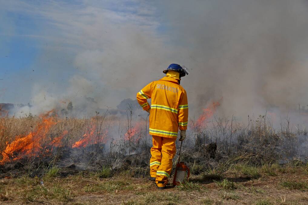 MITIGATION: Seqwater recreation and catchment operations supervisor Matthew Wellington carries out a planned burn in SEQ. Photo: Supplied