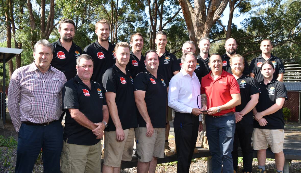 TOP JOB: Alexandra Hills TAFE campus building and construction trainers with campus officer Allen Nuttall (L), business manager Barry Evans and Capalaba MP Don Brown. Photo: Hannah Baker