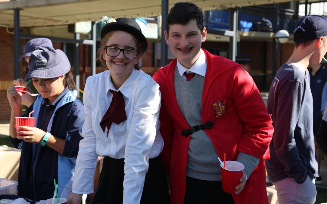 CHEERS: Paige Jewell as Mary Poppins with  Zac Anderson, who is dressed as a Hogwarts' student. Photo: Supplied