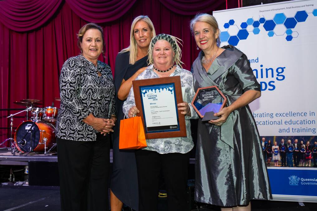 GREAT WORK: Julie Larson holds Running Wild's south-east Queensland finalist award, presented by Redlands MP Kim Richards at an awards ceremony in July. Photo: Supplied