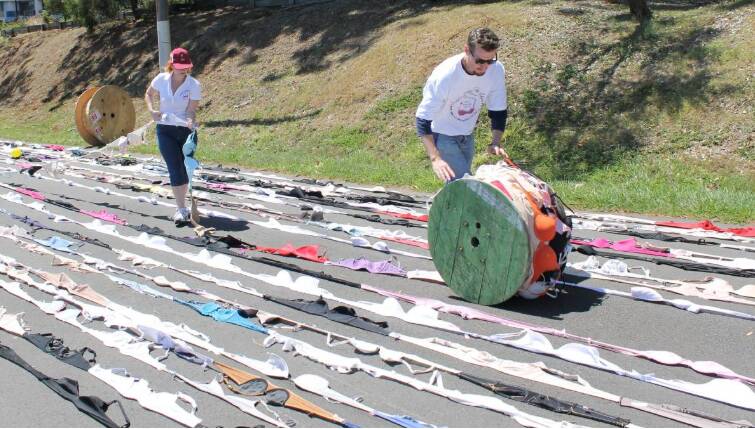 Giant spools were used to roll out linked bra for Caryn's first world record attempt in 2013. Photo: Karen Hurst