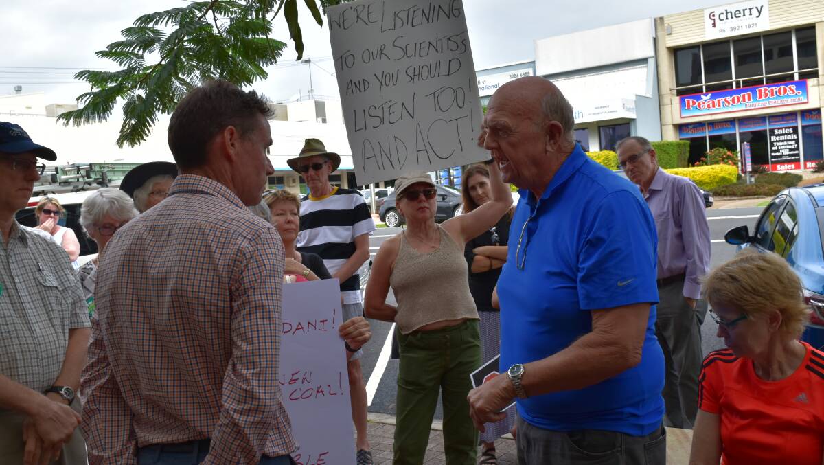 Stan Perkins voices his opinions to Bowman MP Andrew Laming at the rally. 