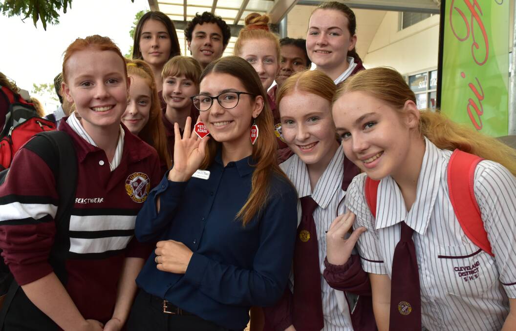 Greens candidate for Bowman, Emerald Moon, with Cleveland District State High School students. She wears Stop Adani earrings. 