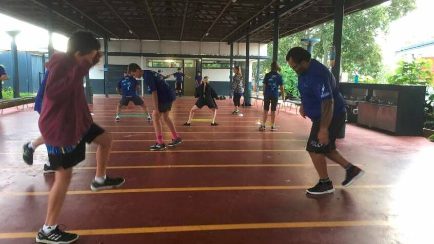 TRAINING PROGRAM: Police help students to develop their physical and teamwork skills. Photo: Queensland Police Service
