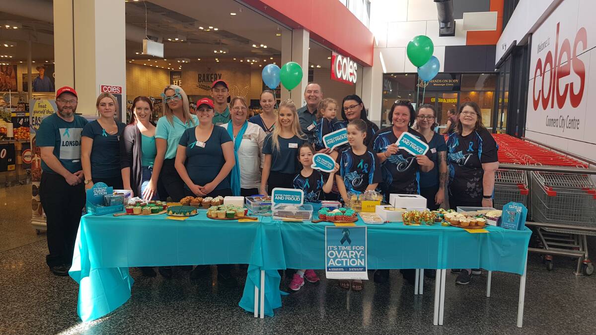 HELPING OUT: Coles team members launch their fundraiser to help women with ovarian cancer. Teal-coloured pens can be bought for $3 and pens for $4 to help Ovarian Cancer Australia. Photo: Supplied