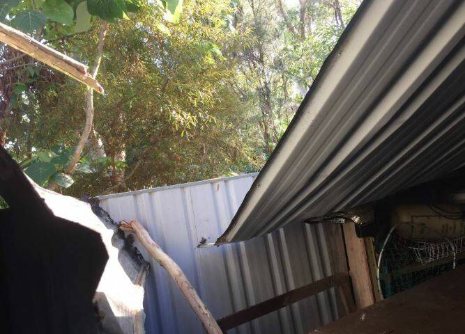 STORM SEASON: NMRA Insurance has Capalaba and Alexandra Hills on list of top five worst storm affected areas in the greater Brisbane region last financial year. Pictured is storm damage to shed roof in February at Alexandra Hills. 
