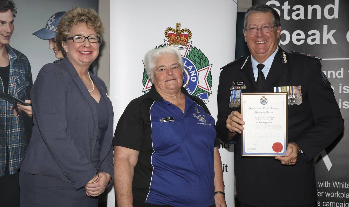 Rosie Nicol stands centre with Police Commissioner Ian Stewart. Photo: Queensland Police Service