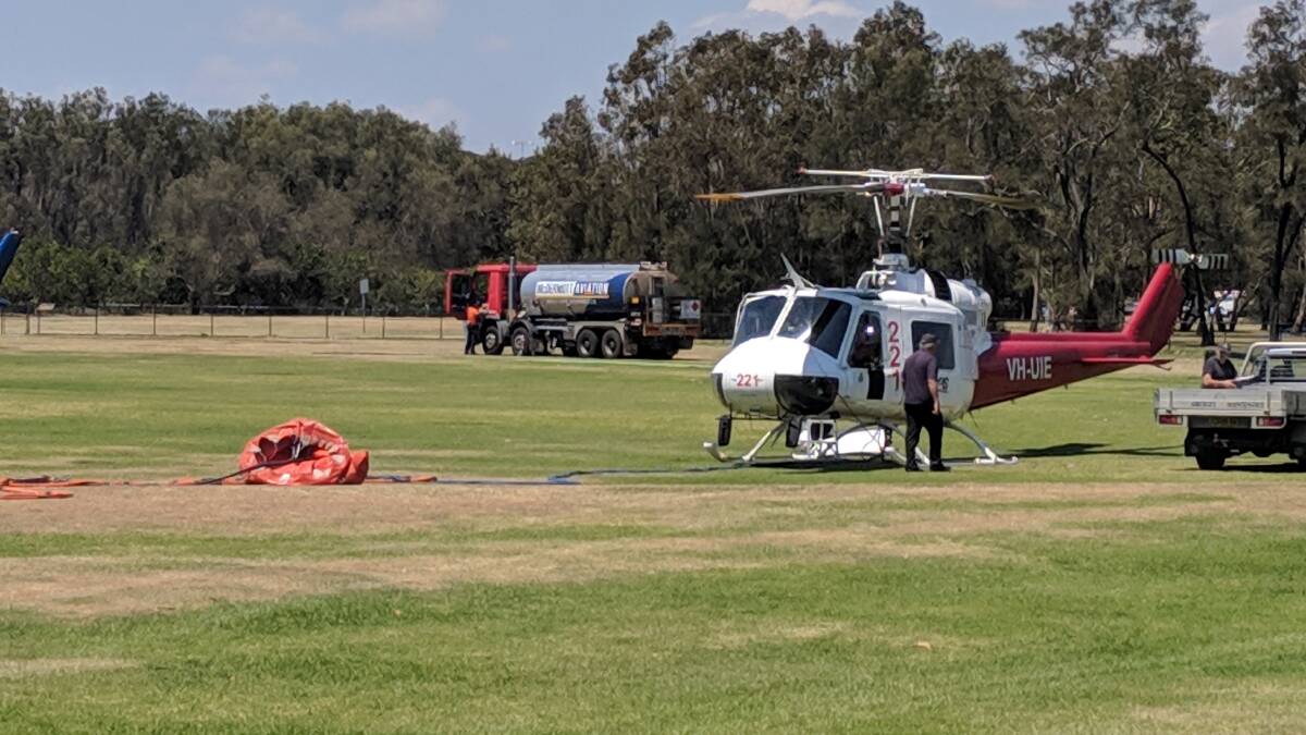 Water-bombing helicopters refuelling at GJ Walter Park.