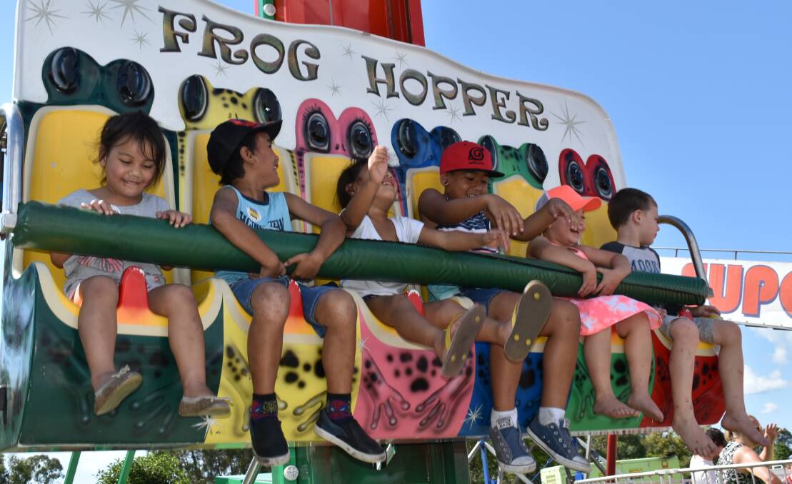 EASTER FUN: Children sat on the Frog Hopper ride as it bounced up and down.  A variety of free entertainment kept families amused at the festival. Photo: Hannah Baker