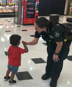 HIGH FIVE: The Coffee with a Cop event at Capalaba Central Shopping Centre was well attended, with plenty of kids and their parents visiting to meet police. Photo: Queensland Police Service