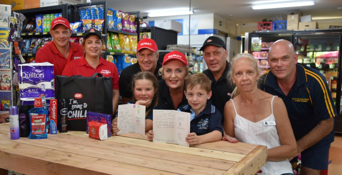TOP CAUSE: Remax Bayside Properties have teamed up with Alexandra Hills IGA X-press and realestate.com.au to deliver care packs to homeless people in the Redlands. The packs include Christmas cards with messages penned by Hilliard State School students.