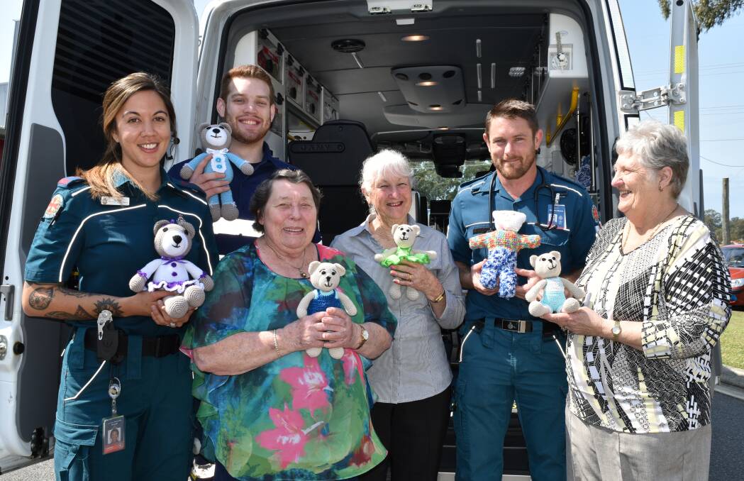 Redland Bay station paramedic Kowai Timu, QUT student paramedic Ciaran Dunne and   officer-in-charge Andrew Morris with local ambulance committee volunteers Evelyn Richardson, Jan Sommerville and Carol Night. Photo: Hannah Baker