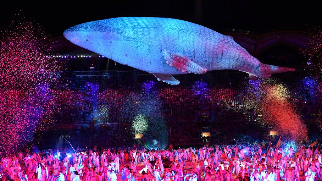 BEAUTIFUL SIGHT: Migaloo ghosts out over performers at the end of the Commonwealth Games opening ceremony. Photo: Darren England / AAP